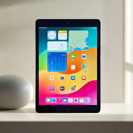 Tablet with a colorful display on a light surface