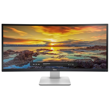 Dell curved monitor with a silver stand, shown against a plain white background. The screen displays a colorful sunset landscape over rocky water.
DELL U3415W Curved ULTRASHARP Ultra-Wide Quad HD, HDMI,  Monitor vtora upotreba