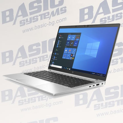 A silver HP laptop with a black keyboard and screen, displaying the Windows desktop, set against a light background with a repeating gray 'BASIC SYSTEMS' watermark.
HP EliteBook 830 G8 Laptop vtora upotreba