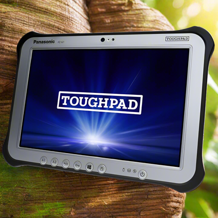 Panasonic TOUGHPAD tablet on a wooden surface with a natural background