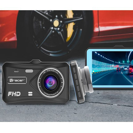 A black FHD dash cam with a silver lens ring and side mount shown in front of a blurred red car wheel, with a screen displaying a tunnel road scene.
TRACER 4TS FHD CRUX Dash Cam FHD Videoregistrator 4.0D, Rezhim na parkirane, Detektor na dvizhenie