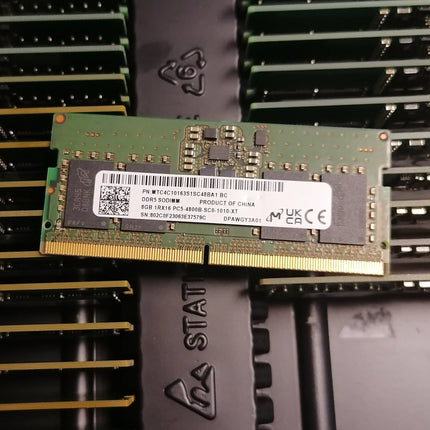 Close-up of a RAM module with branding on a blurred background