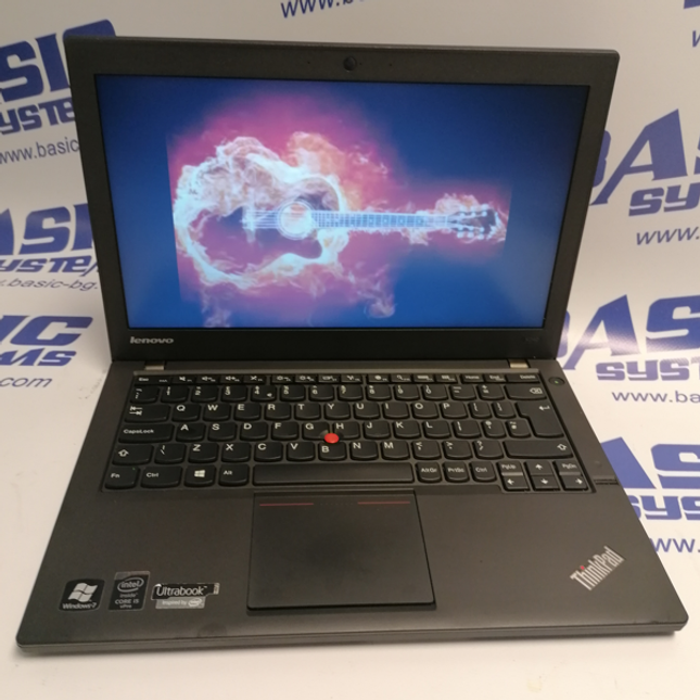 Поглед от горе на Лаптоп втора употреба Lenovo ThinkPad X240 - CPU i5-4300U, 8GB RAM, 128GB SSD в отворено  положение на дисплея.На бял фон с лого basic systems и www.basic-bg.com. Виждат се 12 инчов дисплей, камера, лого на thinkpad, клавиатура втора ръка и тъчпад.