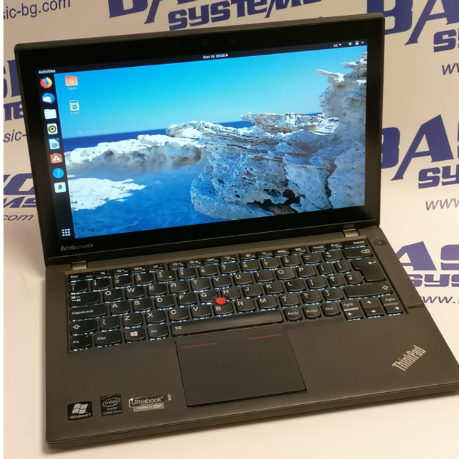 Снимка на Лаптоп втора употреба Lenovo ThinkPad X240 отгоре в отворено положение на дисплея. Вижда се дисплея на лаптопа, камерата, клавиатура с подсветка, тъчпад и лого thinkpad в долната дясна част на корпуса на лаптопа. Лаптопа е сниман на бял фон с отпечатани лого и надписи basic systems, www.basic-bg.com.